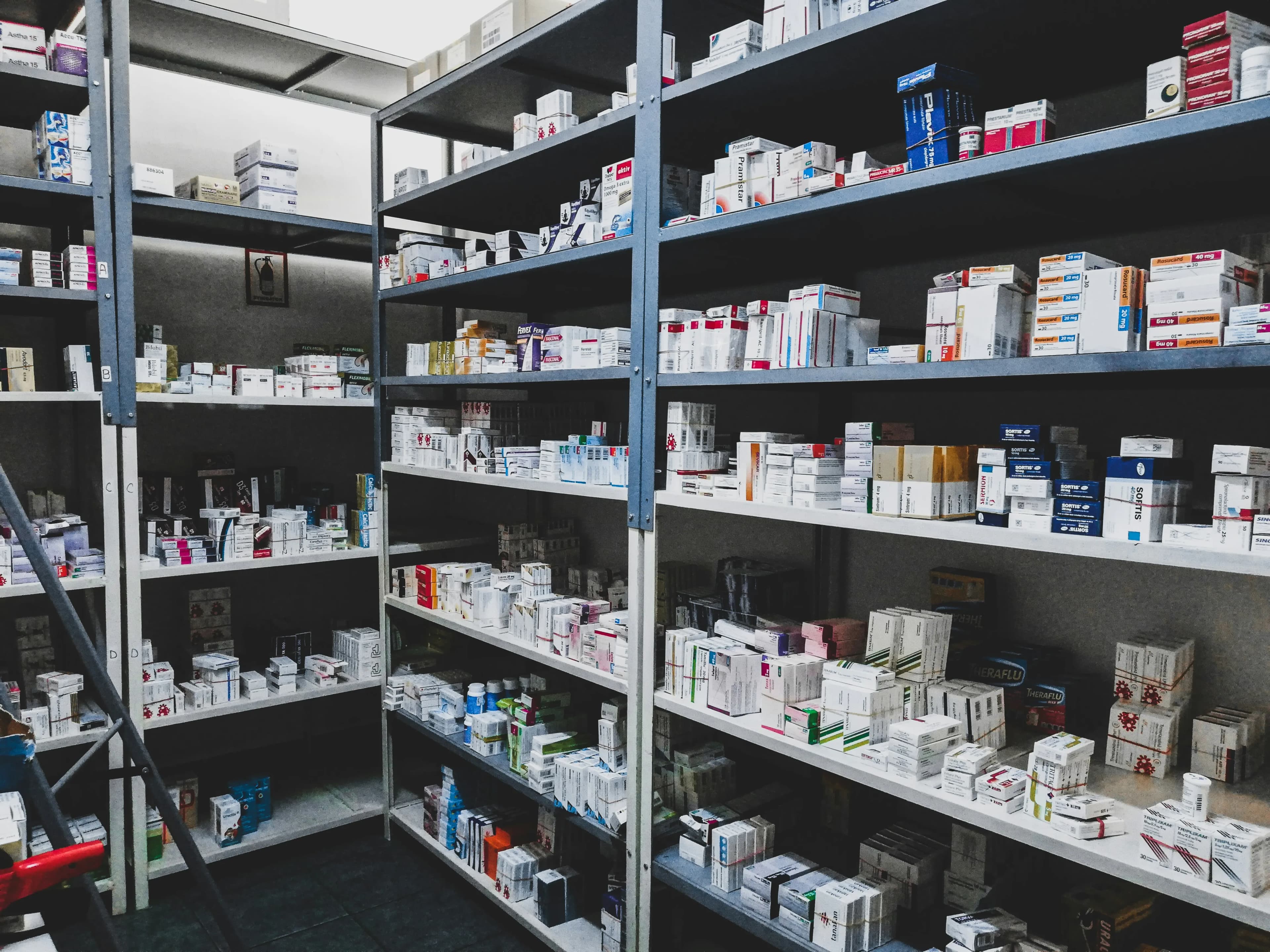 Dispensary shelves stocked with boxes of medicines at Resolven Pharmacy